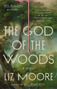 God of the Woods by Liz Moore — dark, atmospheric cover with a forest canopy and ominous green tones evoking the Adirondack wilderness